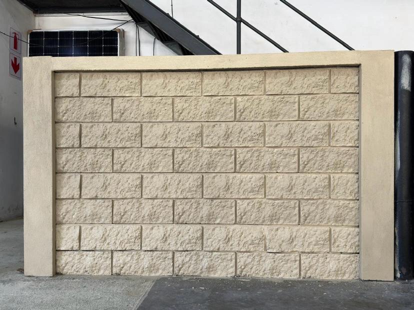 A cast BlockCrete panel. The stone texture comes straight off the mold face, with no liner involved.